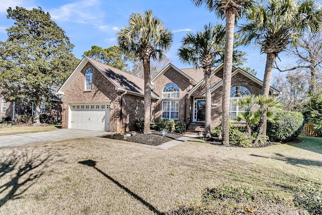 view of front property featuring a garage and a front yard