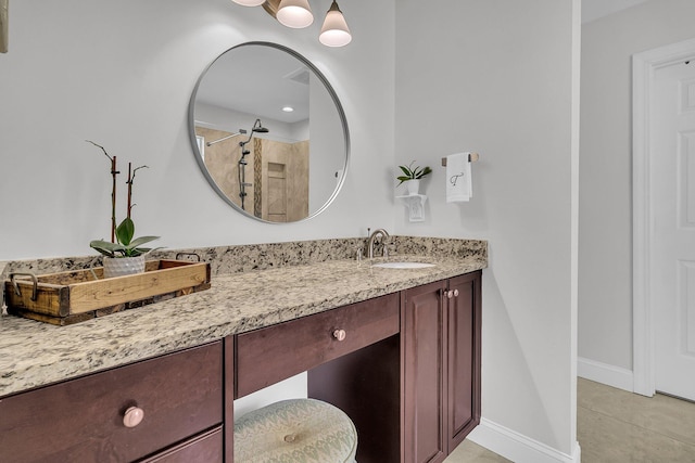 bathroom with vanity, tile patterned floors, and walk in shower