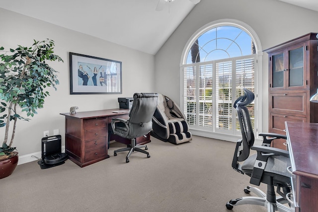 carpeted office space featuring lofted ceiling and ceiling fan