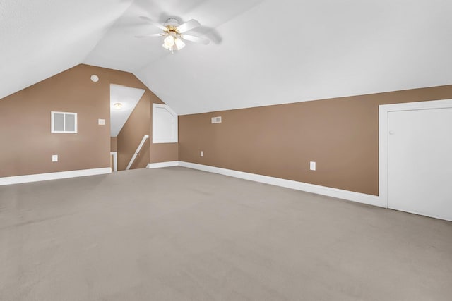 bonus room with ceiling fan, lofted ceiling, and carpet floors