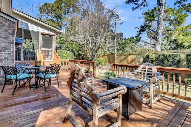 wooden terrace featuring a sunroom