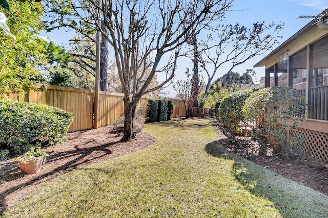 view of yard with a sunroom