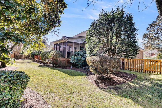 view of yard featuring a sunroom