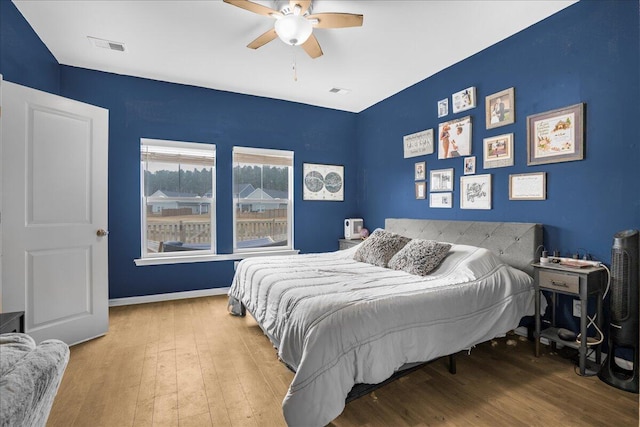 bedroom featuring ceiling fan and hardwood / wood-style floors