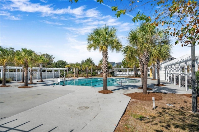 view of swimming pool featuring a pergola and a patio area