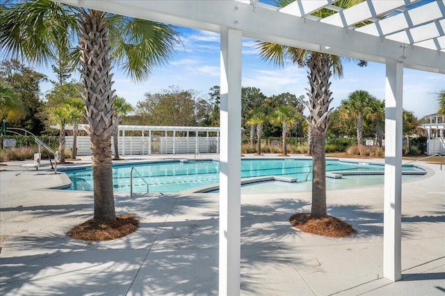 view of pool with a pergola and a patio area