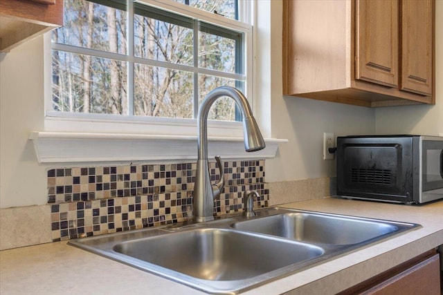 details with decorative backsplash and sink