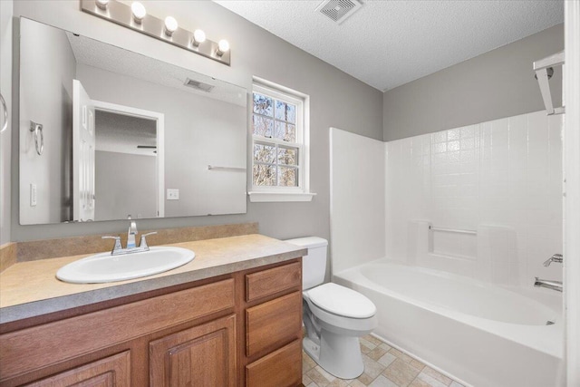 full bathroom with vanity, toilet, tub / shower combination, and a textured ceiling