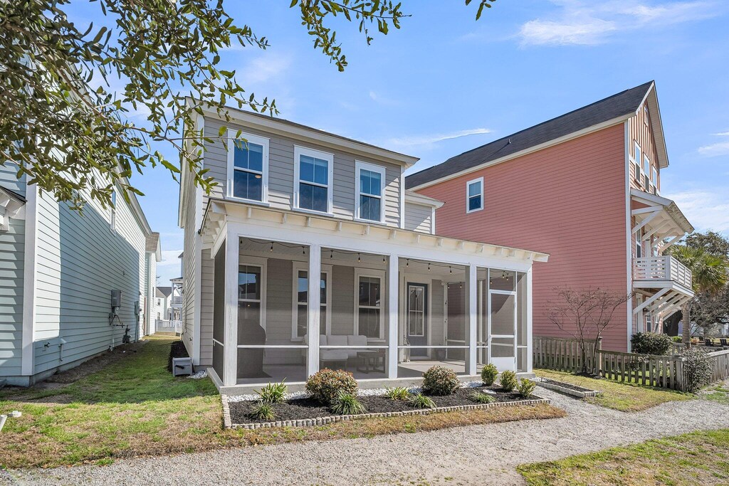 4603 Scout Aly, North Charleston, SC 29405 - view of front facade with a front yard, a sunroom, and fence