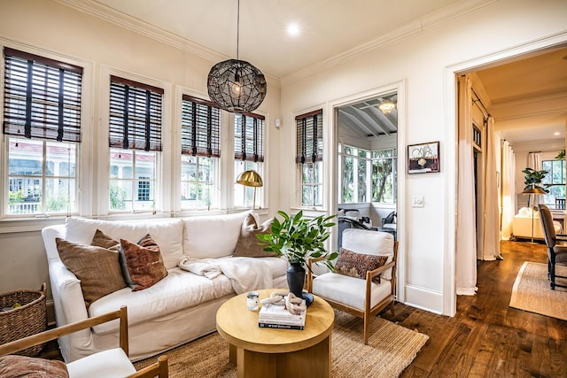 interior space with ornamental molding, dark wood-type flooring, and an inviting chandelier