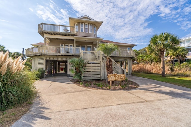 view of front of house with a porch and a carport