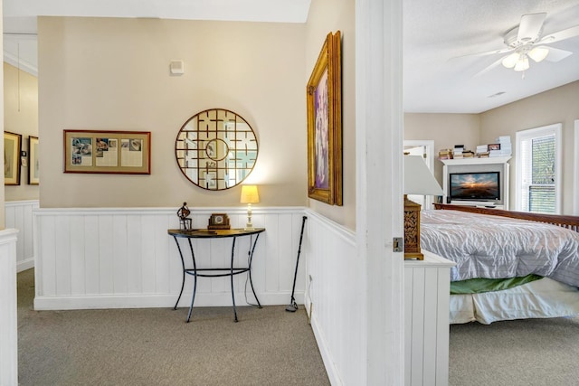 interior space with ceiling fan