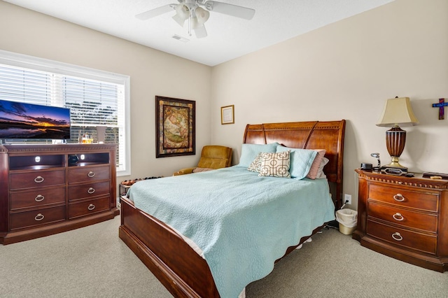 bedroom featuring ceiling fan and carpet floors