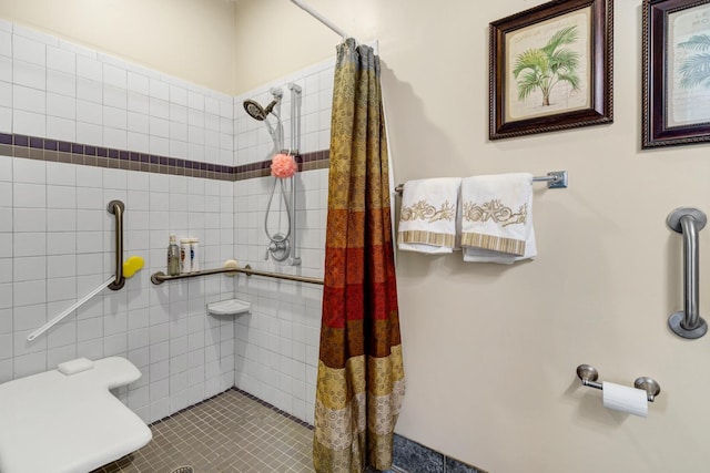 bathroom with tile patterned flooring and walk in shower