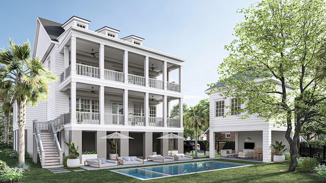 rear view of property with a fireplace, a balcony, a patio, and ceiling fan