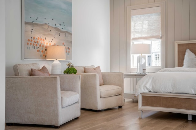 bedroom featuring radiator and light hardwood / wood-style floors