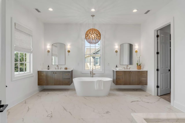 bathroom with vanity and a bathing tub