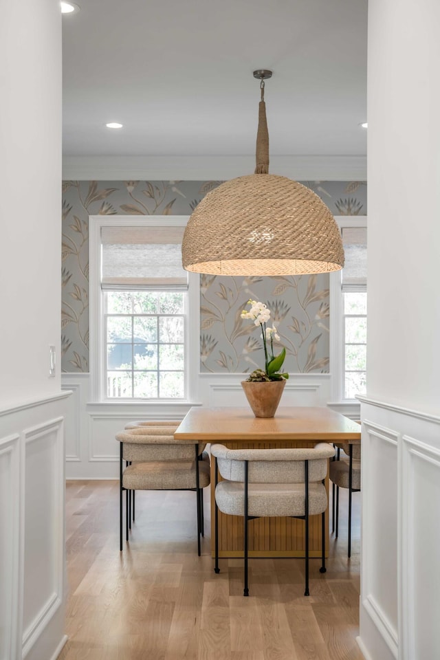 dining area featuring breakfast area, light hardwood / wood-style flooring, and a wealth of natural light