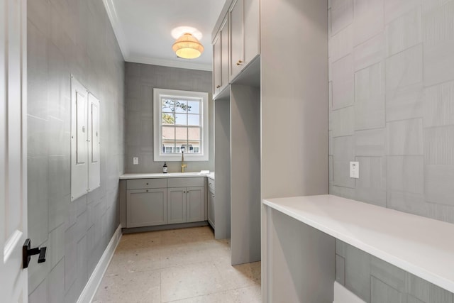 interior space with crown molding and vanity