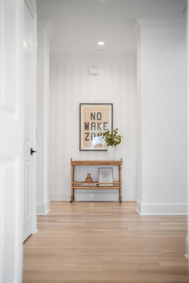 details with ornamental molding and hardwood / wood-style floors