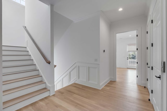 stairs featuring wood-type flooring