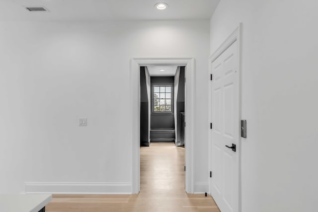 hall with light wood-type flooring