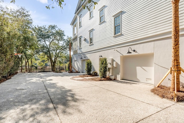 view of side of home featuring a garage