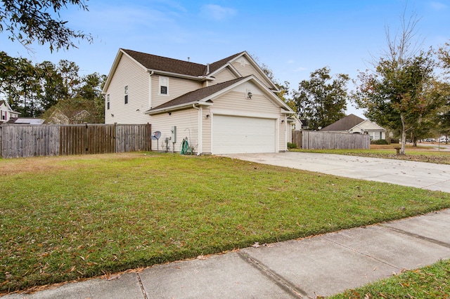 view of front of home featuring a front lawn and a garage