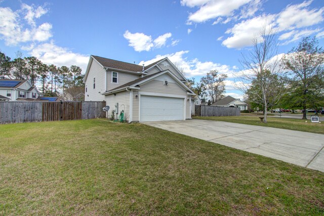 174 Education Blvd, Ladson, SC 29456 - view of side of property with fence, a yard, driveway, and a garage