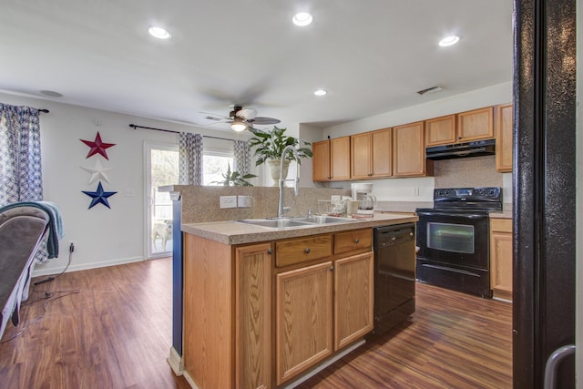 174 Education Blvd, Ladson, SC 29456 - kitchen featuring under cabinet range hood, dark wood-style floors, a sink, and black appliances
