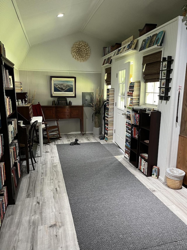 interior space featuring lofted ceiling and wood finished floors