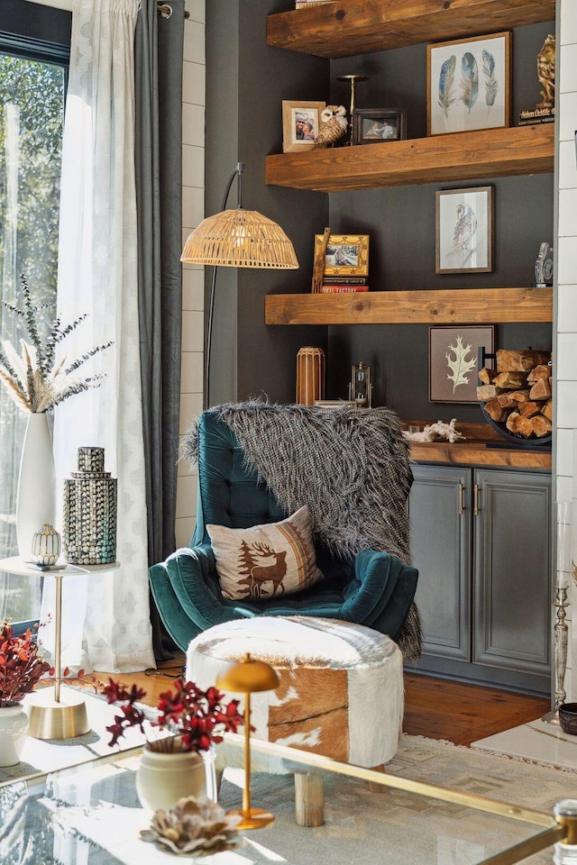 sitting room with wood-type flooring