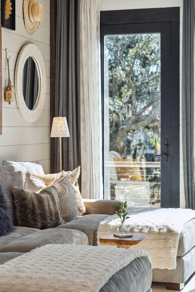 bedroom featuring wooden walls