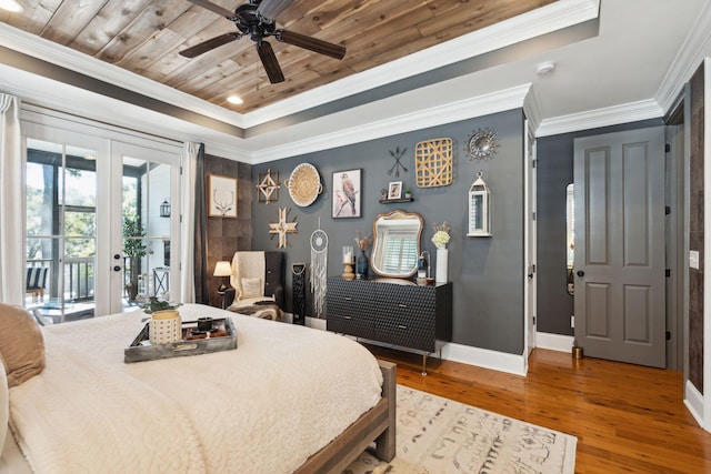 bedroom with hardwood / wood-style flooring, ceiling fan, crown molding, and wood ceiling