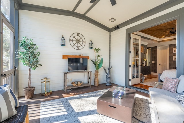 living room featuring hardwood / wood-style flooring, ceiling fan, vaulted ceiling, and wooden ceiling