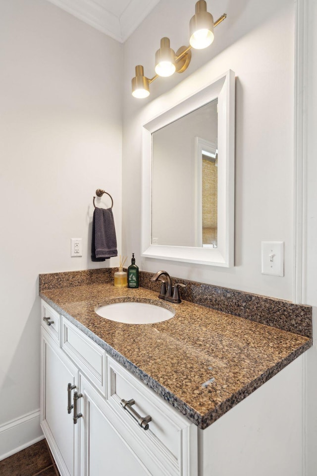 bathroom featuring vanity, tile patterned floors, and ornamental molding