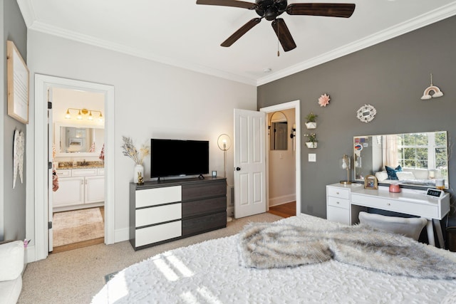 bedroom featuring ensuite bathroom, ceiling fan, crown molding, and sink