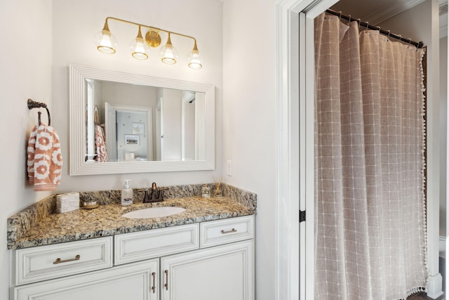 bathroom with curtained shower and vanity