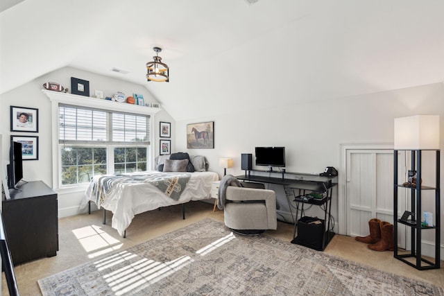 carpeted bedroom featuring vaulted ceiling