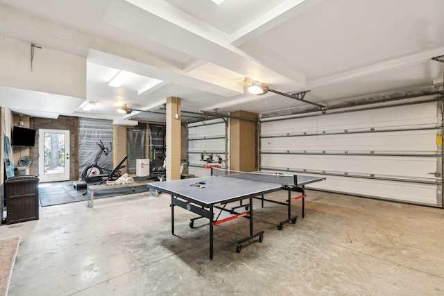 recreation room with concrete flooring