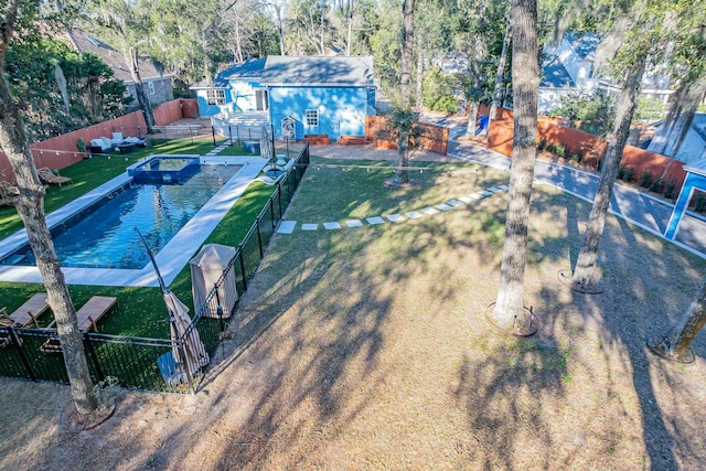 view of yard featuring a fenced in pool and a fenced backyard