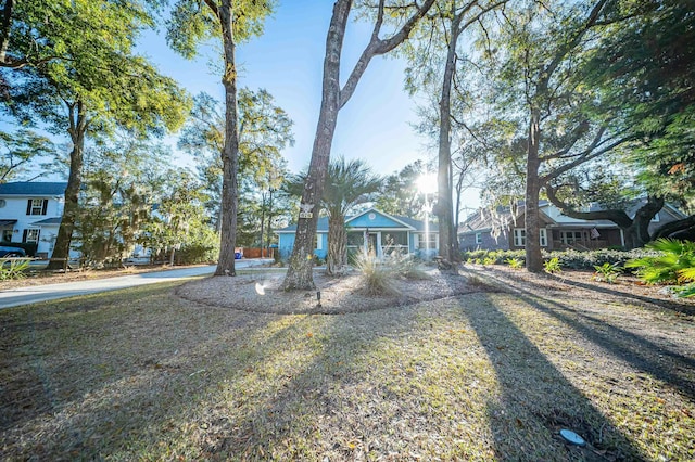 view of front of house featuring a residential view and a front yard