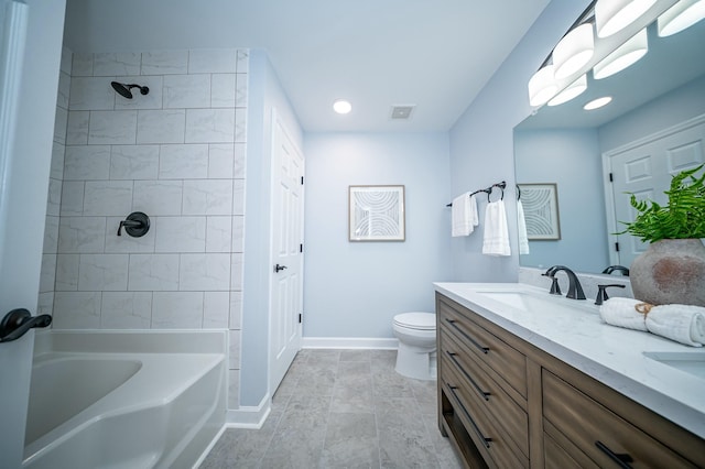 full bathroom with double vanity, visible vents, toilet, a sink, and baseboards