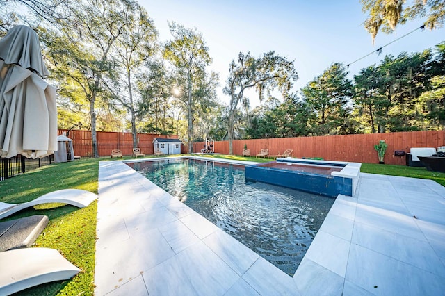 view of swimming pool featuring an outbuilding, a fenced backyard, a fenced in pool, a patio area, and a hot tub