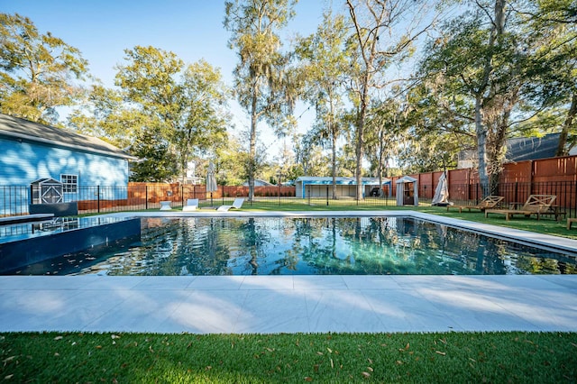 view of pool featuring a fenced in pool and fence