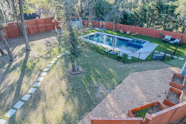 view of pool featuring a pool with connected hot tub, a fenced backyard, and a lawn