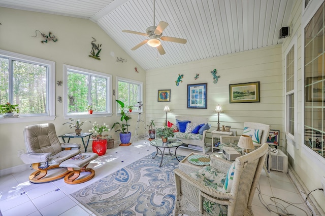 sunroom featuring tile patterned flooring and lofted ceiling