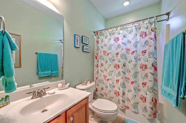 full bath with vanity, shower / bath combo, and toilet