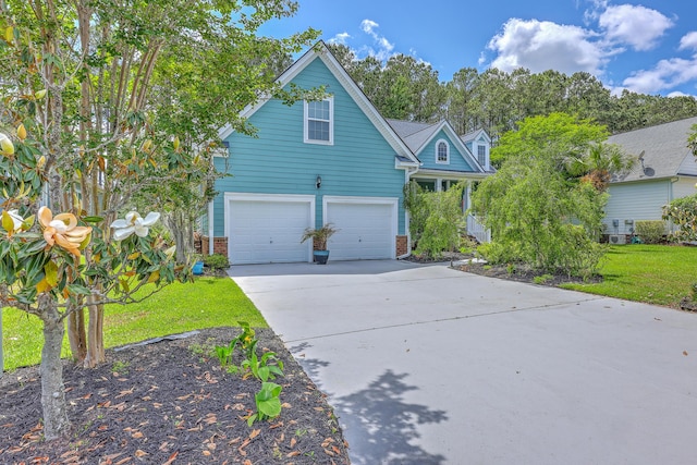 view of front of home featuring an attached garage, concrete driveway, and brick siding