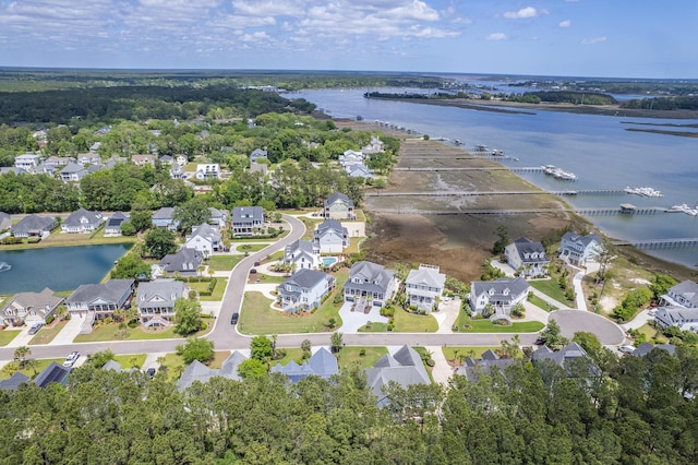 bird's eye view featuring a water view and a residential view